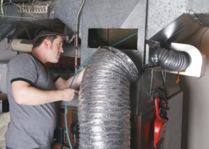 technician-cleaning-ductwork